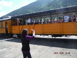 06-27 Here is our train coming in The girl at the crossing handles the tickets and was very pleasent