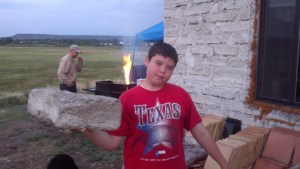 07-04 for Dinner we got invited to a great BBQ party in Springerville. This fellow build a great house out of papercrete blocks he made Anthony is holding one, they weigh nothing and are waterproof