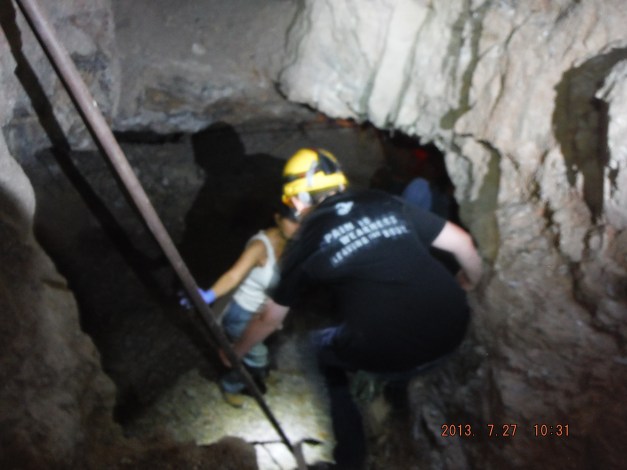 07-27 Climbing down to a lower level. We were down about 300 feet. The water table is a 500 feet. Since there are no more water pumps working  everything below 500 feet is flooded today.  The guide we had on opened up this exploring mine and does this one day month for a small group. 